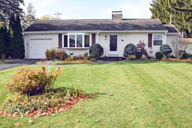 ranch-style home with a front lawn and a garage