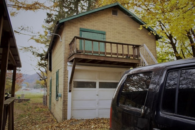 back of property with a balcony