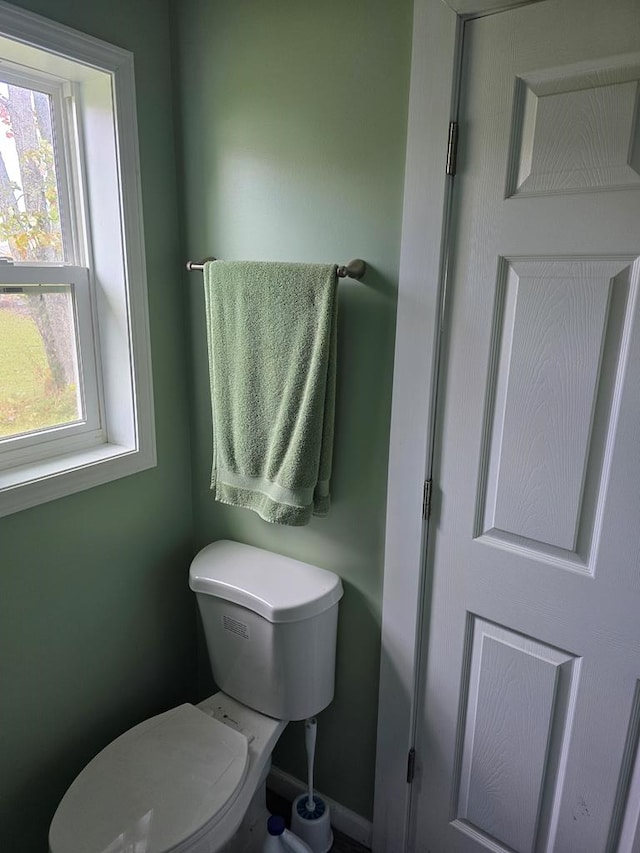 bathroom with a wealth of natural light and toilet