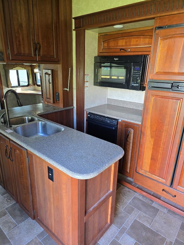 kitchen featuring sink and black appliances