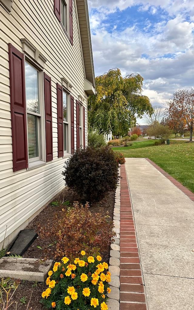 view of home's exterior with a yard