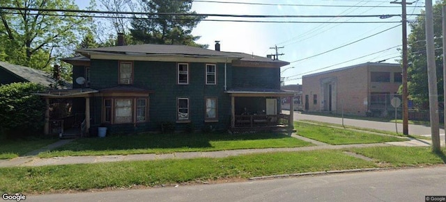 view of front of home featuring a front lawn and a porch