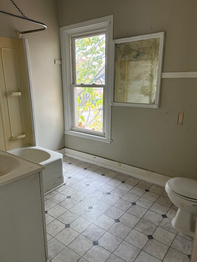 full bathroom with vanity, shower / bathtub combination, and toilet