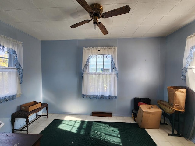 sitting room featuring ceiling fan