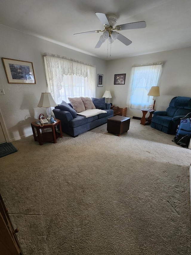 living room with carpet and ceiling fan