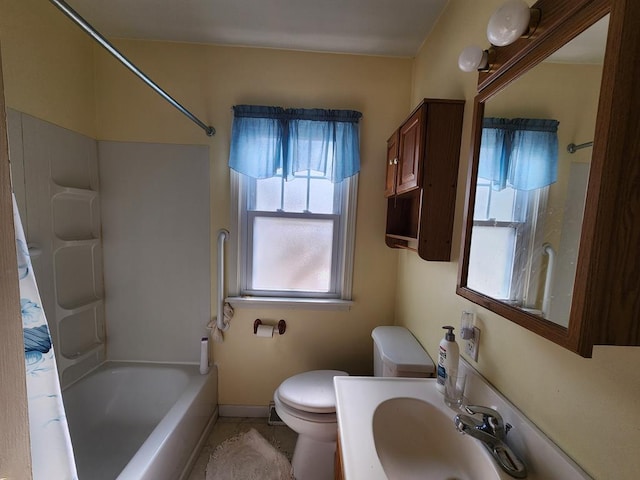 bathroom with sink, tile patterned flooring, and toilet