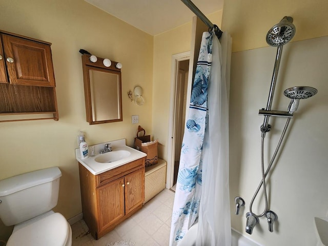 full bathroom with shower / bath combo with shower curtain, vanity, and toilet