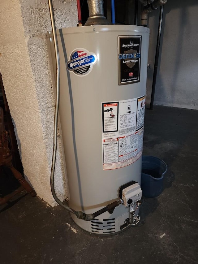 utility room featuring gas water heater