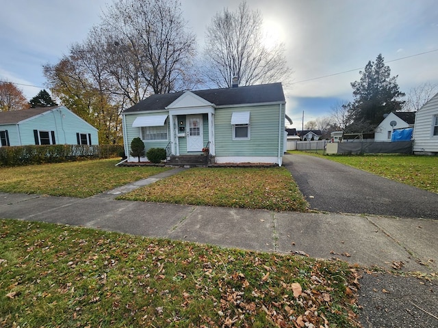 view of front of home with a front lawn