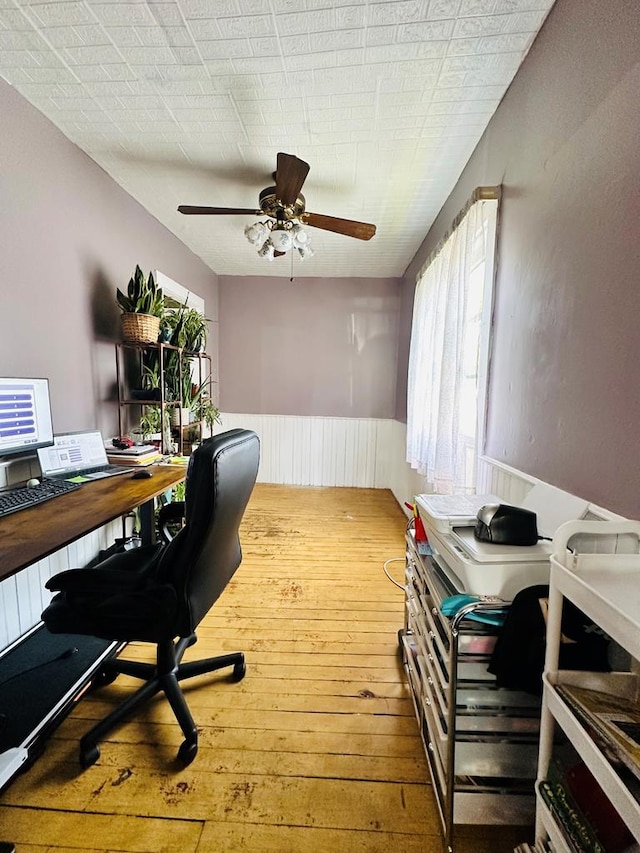 office area with ceiling fan and wood-type flooring