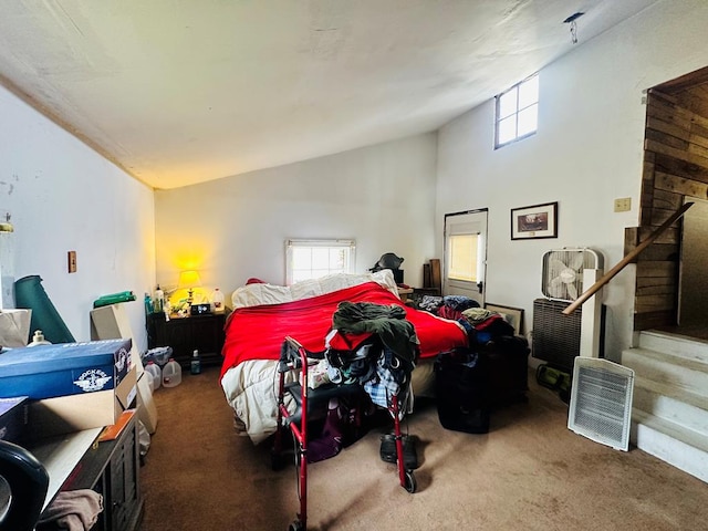 bedroom featuring dark carpet and vaulted ceiling