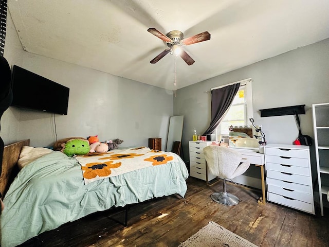 bedroom with dark hardwood / wood-style floors and ceiling fan