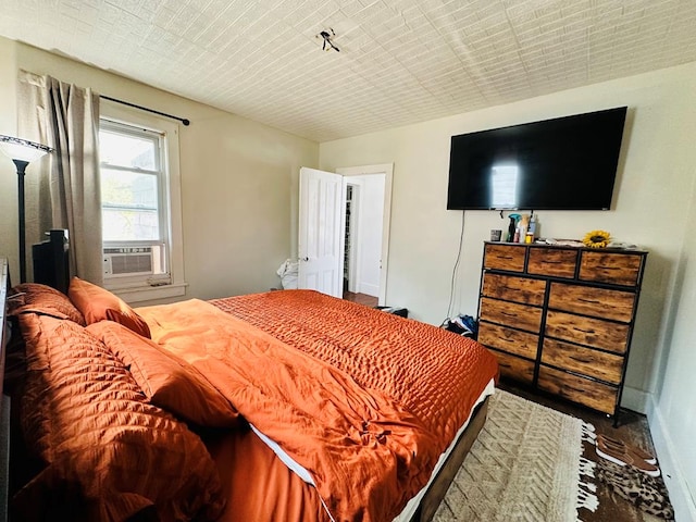 bedroom featuring cooling unit and wood-type flooring