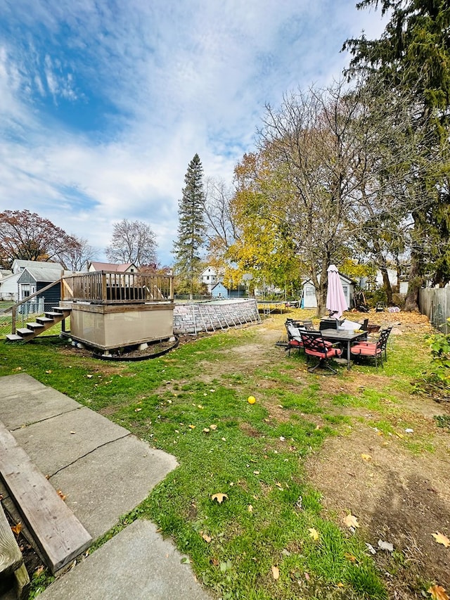 view of yard featuring a wooden deck