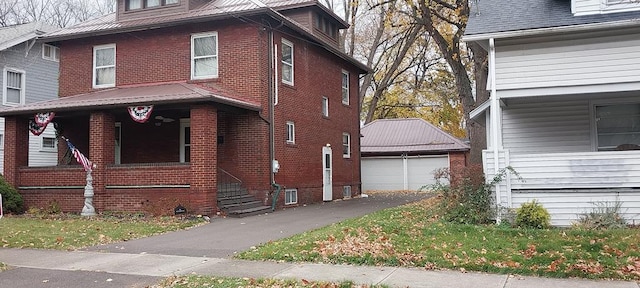 view of property exterior with a garage and an outdoor structure