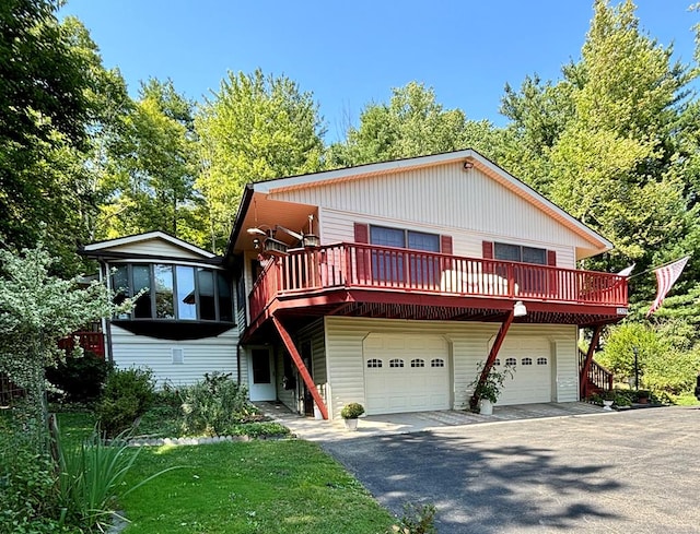 view of front of house with a garage and a wooden deck