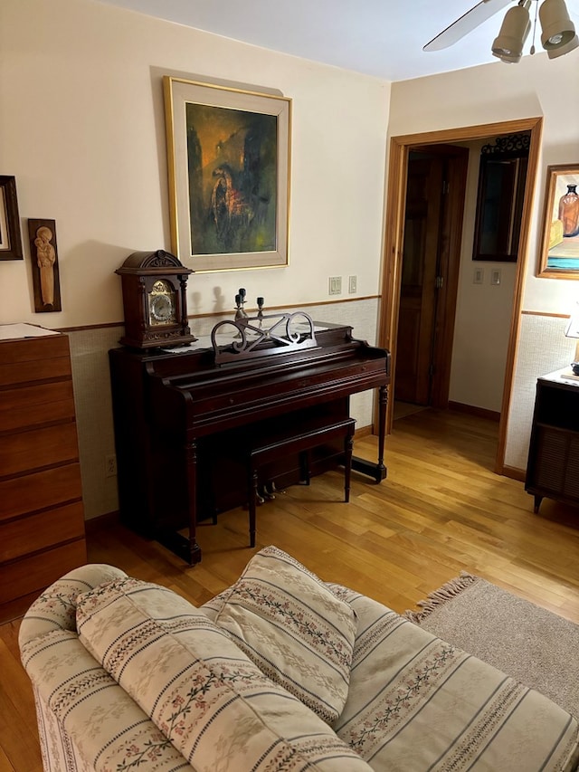 misc room featuring ceiling fan and light wood-type flooring