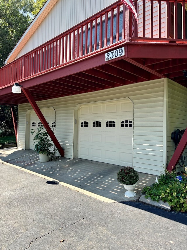 view of side of home featuring a garage