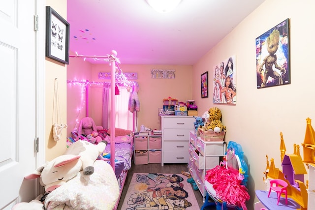 bedroom with dark hardwood / wood-style flooring