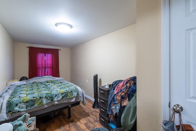 bedroom featuring dark wood-type flooring