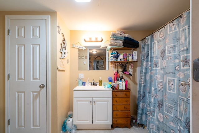 bathroom with walk in shower and vanity