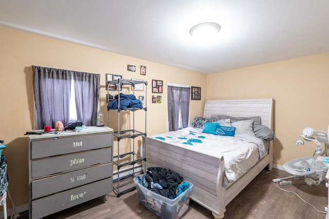 bedroom with hardwood / wood-style floors