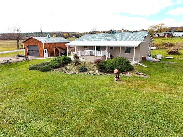 view of front of home with a garage, a front lawn, and a porch