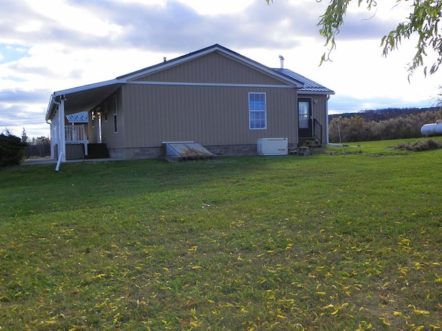 view of home's exterior featuring a yard