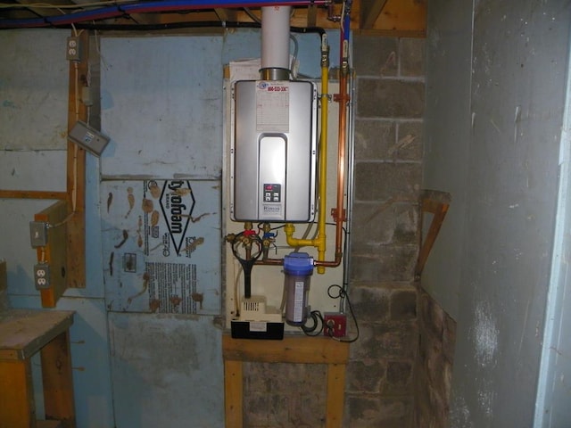 utility room with tankless water heater