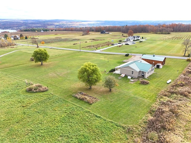 birds eye view of property with a rural view