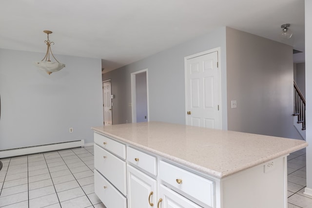 kitchen featuring white cabinetry, hanging light fixtures, light tile patterned floors, baseboard heating, and a kitchen island