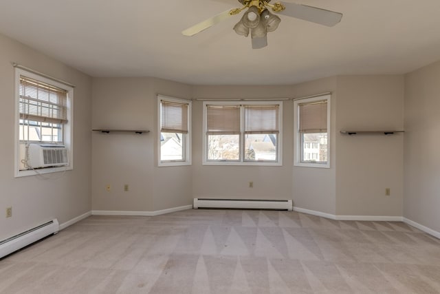 carpeted spare room with ceiling fan, a baseboard radiator, and cooling unit