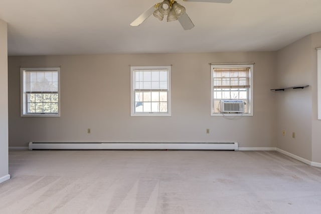 carpeted spare room featuring cooling unit, ceiling fan, and baseboard heating