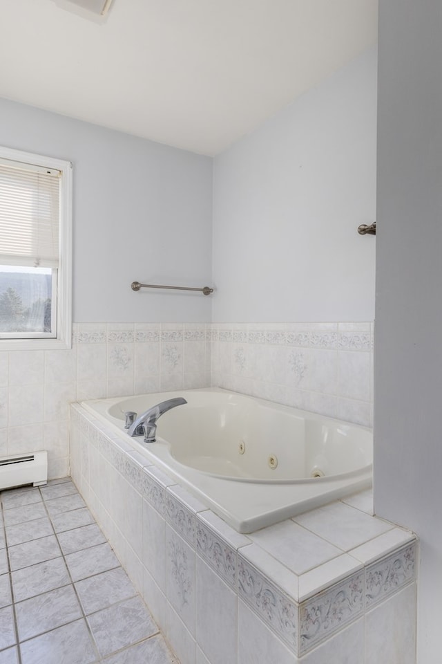 bathroom featuring a baseboard radiator, tile patterned flooring, and tiled tub