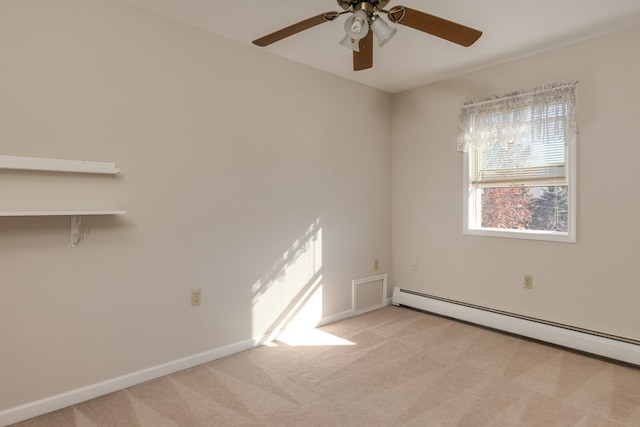 carpeted empty room with ceiling fan and baseboard heating