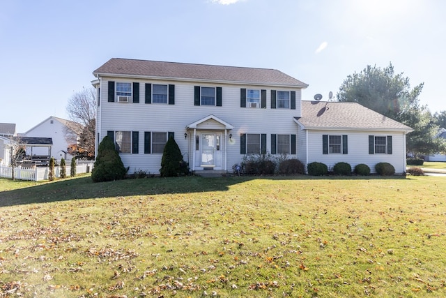 colonial home with a front lawn