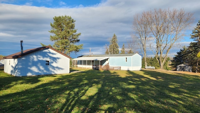 back of property featuring a lawn