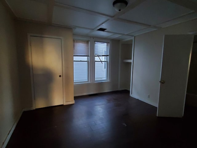 spare room with dark hardwood / wood-style flooring