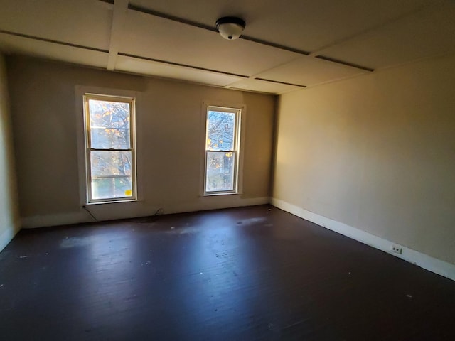 unfurnished room with dark hardwood / wood-style floors