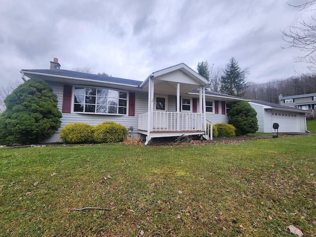 view of front facade featuring a garage, covered porch, and a front lawn