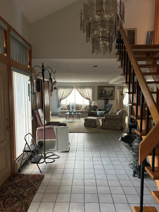 tiled living room featuring a healthy amount of sunlight and vaulted ceiling