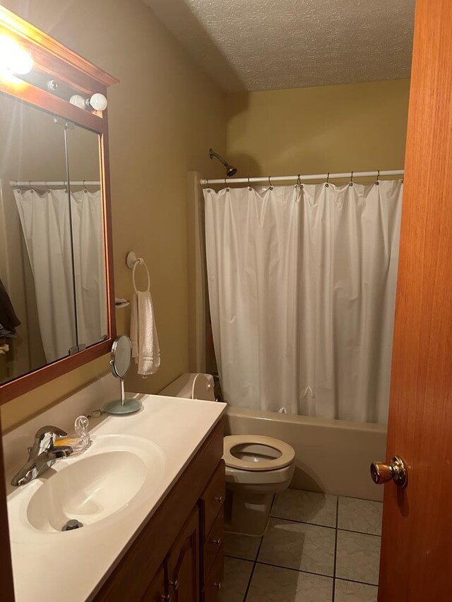 full bathroom featuring tile patterned flooring, shower / bath combination with curtain, a textured ceiling, and toilet