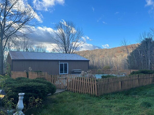 view of side of home featuring a mountain view