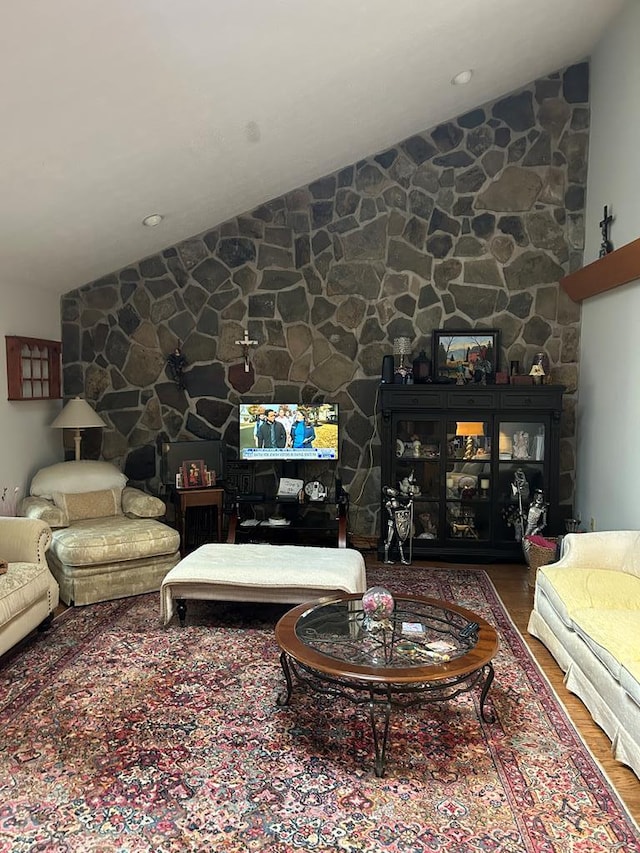 living room featuring hardwood / wood-style floors and vaulted ceiling