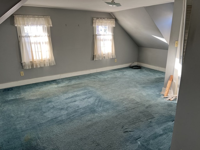 bonus room featuring carpet flooring, plenty of natural light, and lofted ceiling