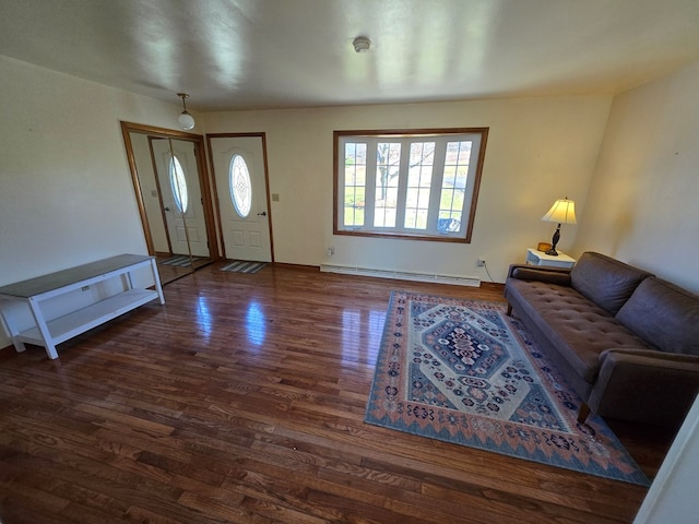 entrance foyer featuring dark hardwood / wood-style floors and a baseboard radiator