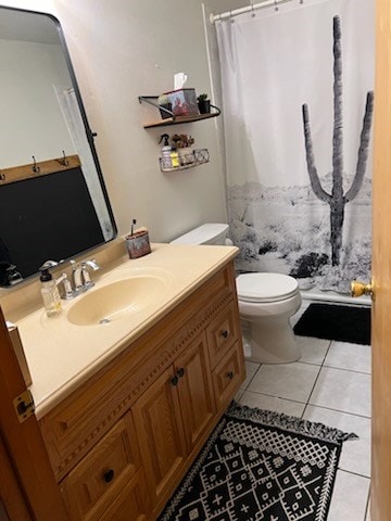 bathroom featuring tile patterned flooring, vanity, toilet, and a shower with curtain