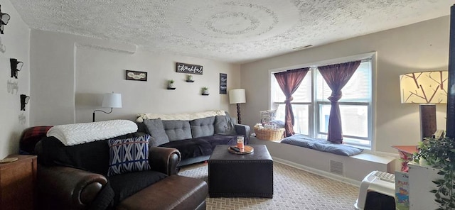 carpeted living room with a textured ceiling