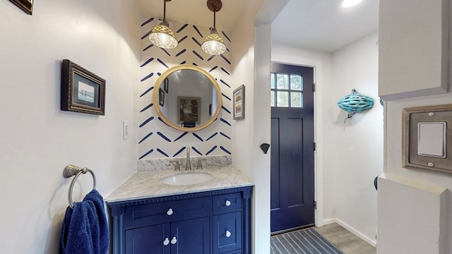 bathroom with hardwood / wood-style floors and vanity