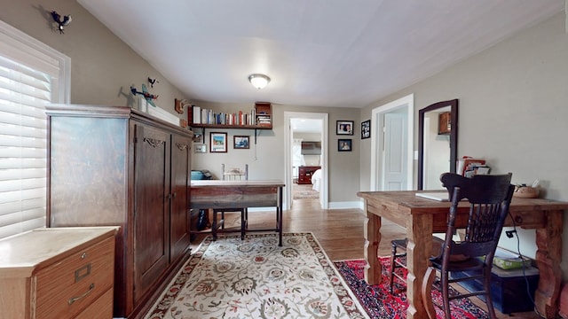 office with light hardwood / wood-style floors